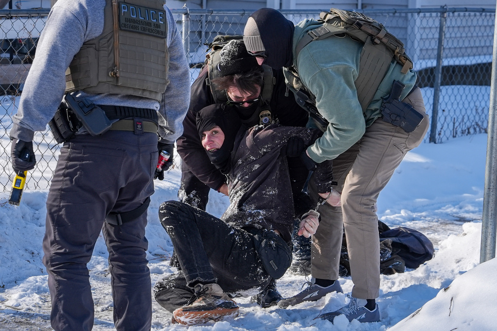 A person is detained by federal agents on Tuesday, Feb. 3, 2026, in Minneapolis. (AP Photo/Ryan Murphy)