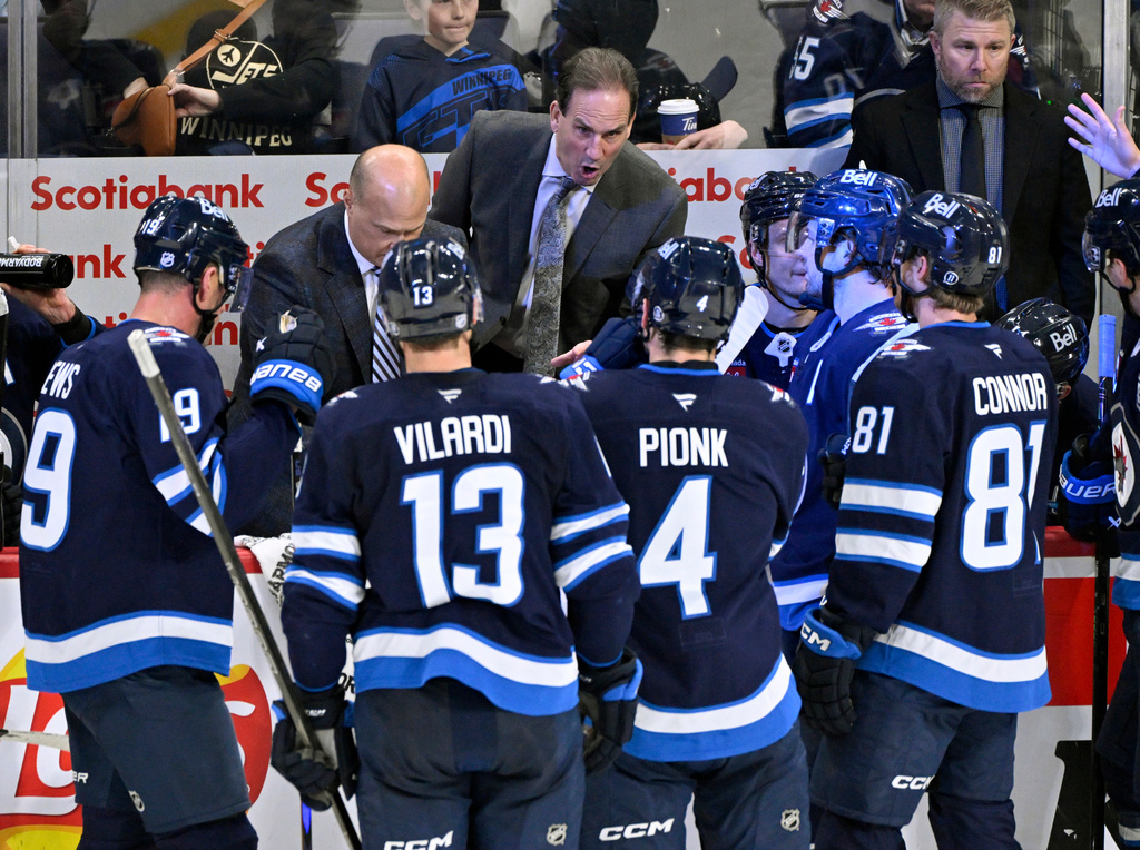 Winnipeg Jets head coach Scott Arniel talks to his players during third period NHL action against the Edmonton Oilers in Winnipeg on Monday Dec. 29, 2025. (Fred Greenslade/The Canadian Press via AP)