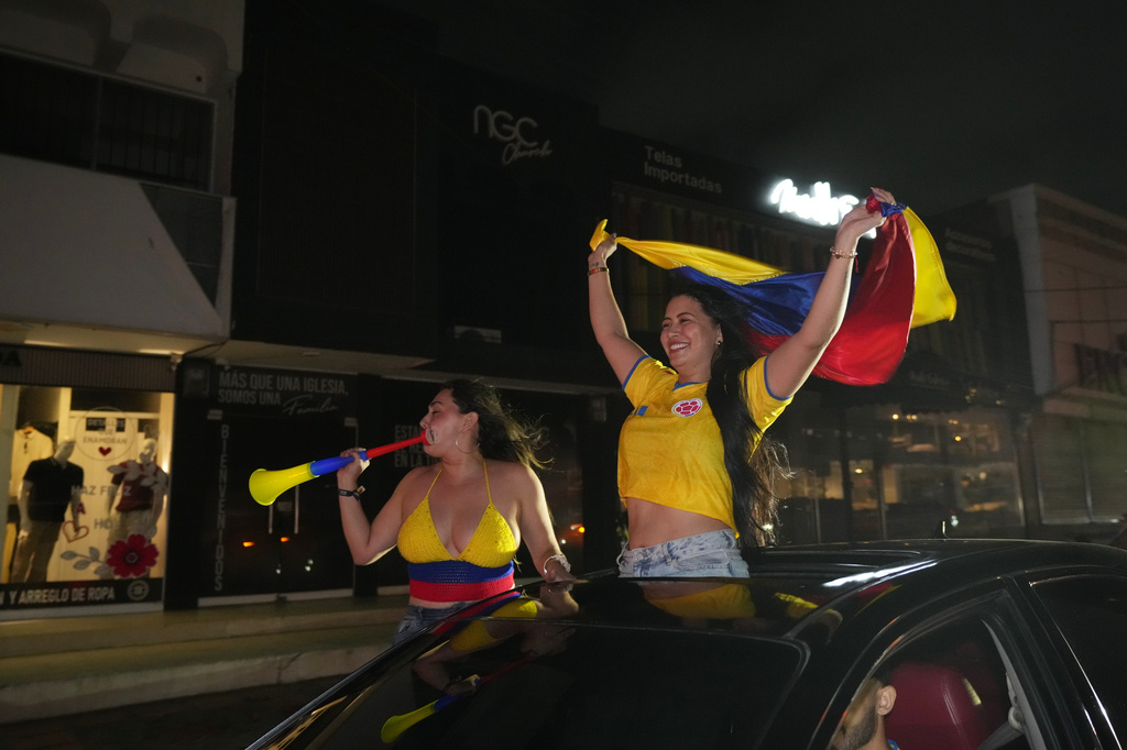Supporters of presidential candidate Abelardo de la Espriella of the opposition Defenders of the Motherland after runoff election results showed him leading in Barranquilla, Colombia, Sunday, June 21, 2026. (AP Photo/Rodrigo Abd)