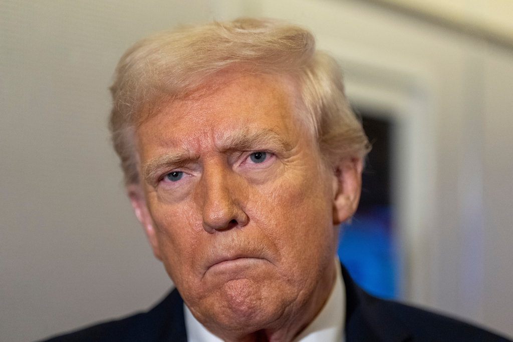 President Donald Trump pauses while speaking with reporters while in flight on Air Force One from Joint Base Andrews to his Mar-a-Lago estate in Palm Beach, Fla., Tuesday, Nov. 25, 2025. (AP Photo/Alex Brandon)