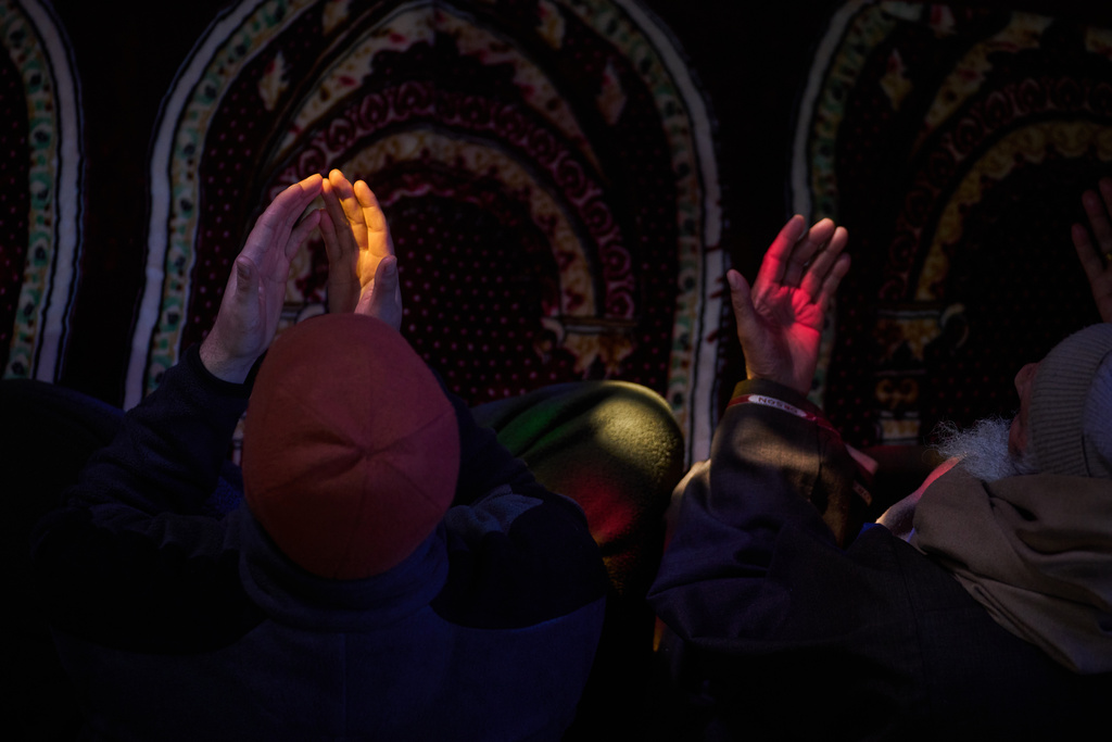 Kashmiri Muslims pray inside the shrine of Sufi saint Sheikh Abdul Qadir Jeelani on the first Friday of Ramadan in Srinagar, Indian controlled Kashmir, Friday, Feb. 20, 2026. (AP Photo/Dar Yasin)