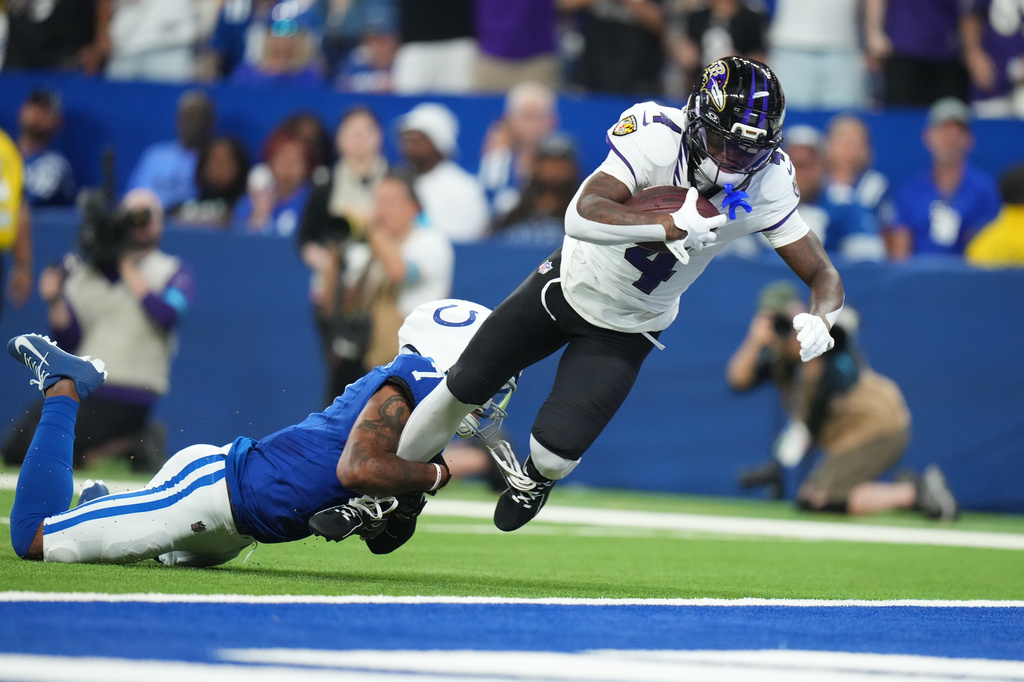 Baltimore Ravens' Zay Flowers gets past Indianapolis Colts' Charvarius Ward for a touchdown during the first half of an NFL football game Sunday, Sept. 13, 2026, in Indianapolis. (AP Photo/AJ Mast)