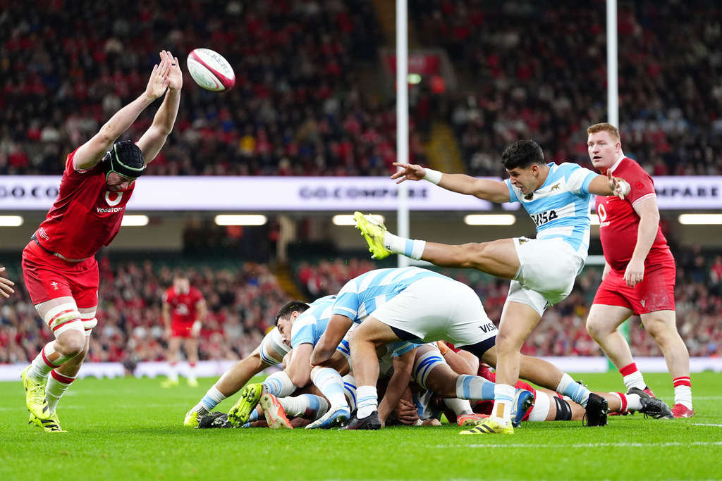 Argentina's Simon Benitez Cruz, front right, clears the ball during the Quilter Nations Series rugby match between Wales and Argentina in Cardiff, Wales, Sunday, Nov. 9, 2025. (David Davies/PA via AP)