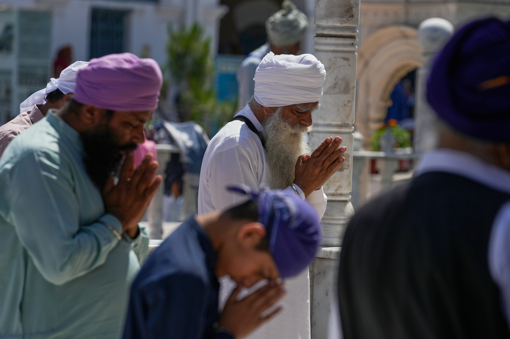 Sikh pilgrims pray during Vaisakhi festival, which also marks the New Year in Sikh tradition, at the shrine of Gurdwara Panja Sahib in Hassan Abdal, Pakistan, Tuesday, April 14, 2026. (AP Photo/Anjum Naveed)