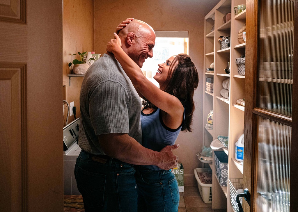 This image released by A24 shows Emily Blunt, right, and Dwayne Johnson in a scene from "The Smashing Machine." (A24 via AP)