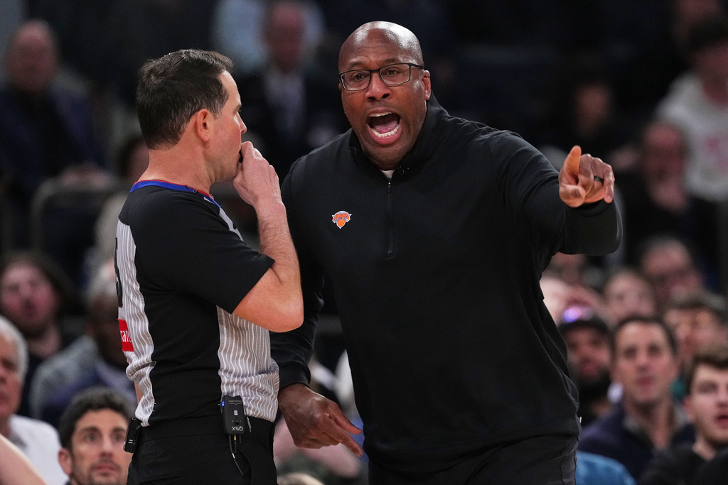 New York Knicks head coach Mike Brown argues a call with an official during the first half of an NBA basketball game against the Oklahoma City Thunder Wednesday, March 4, 2026, in New York. (AP Photo/Frank Franklin II)