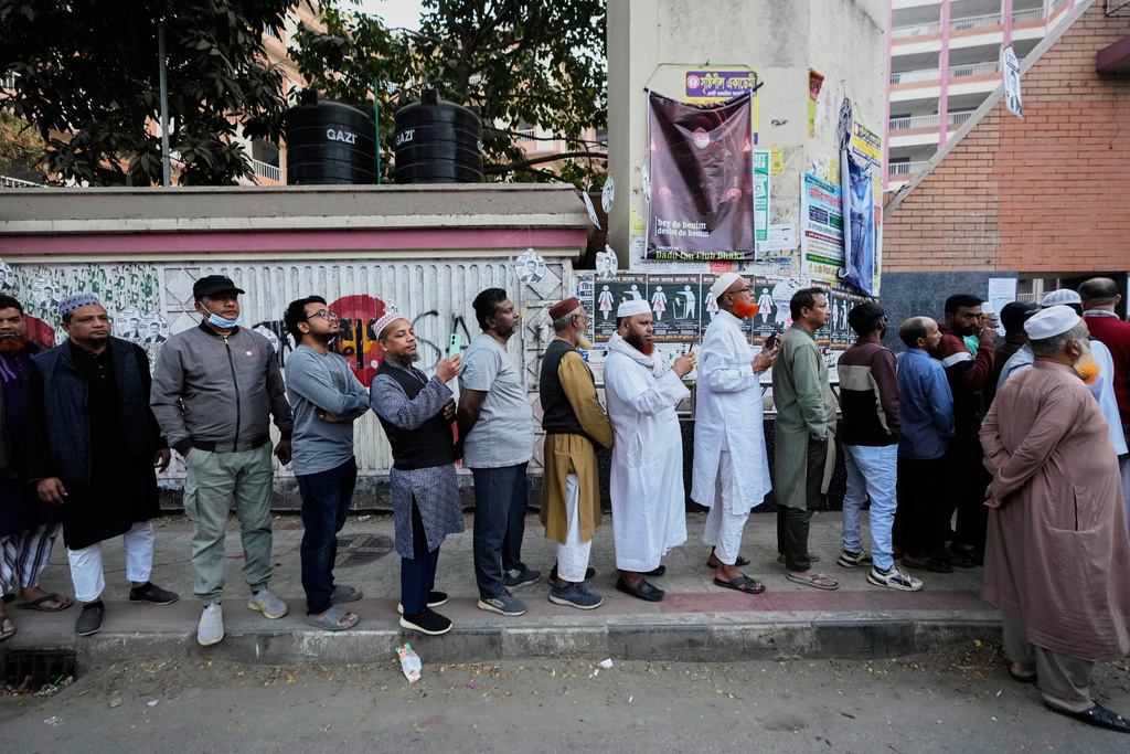Bangladeshi people stand in queue to cast their votes in a polling station during national parliamentary election in Dhaka, Bangladesh, Thursday, Feb. 12, 2026. (AP Photo/Anupam Nath)