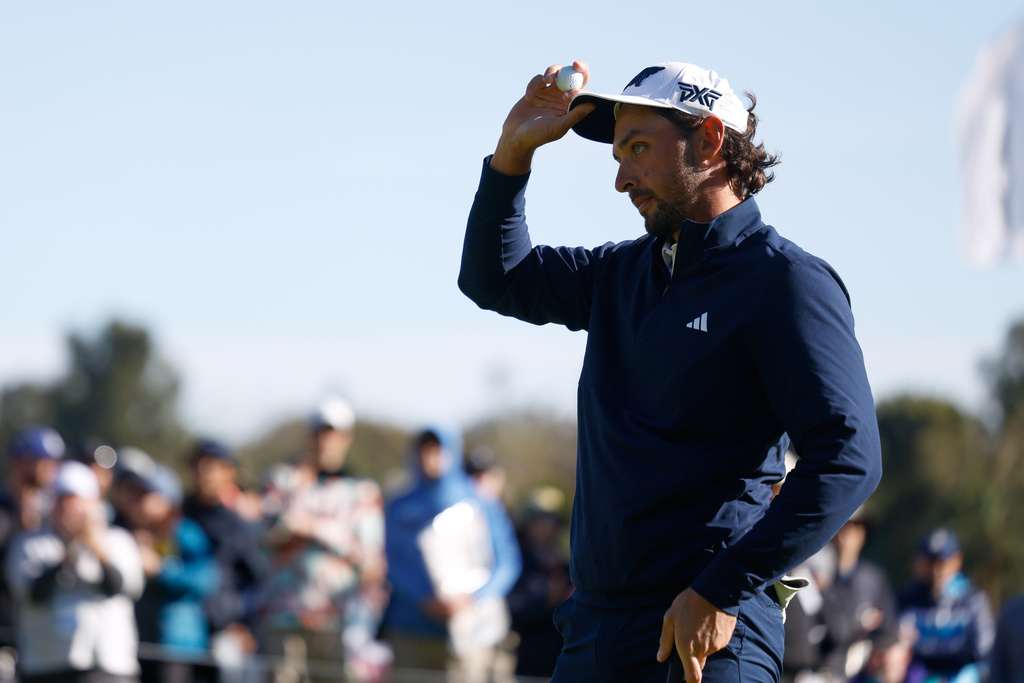 Marco Penge, from England, reacts after putting on the 18th green during the second round of the Genesis Invitational golf tournament at Riviera Country Club, Friday, Feb. 20, 2026, in the Pacific Palisades area of Los Angeles. (AP Photo/Caroline Brehman)