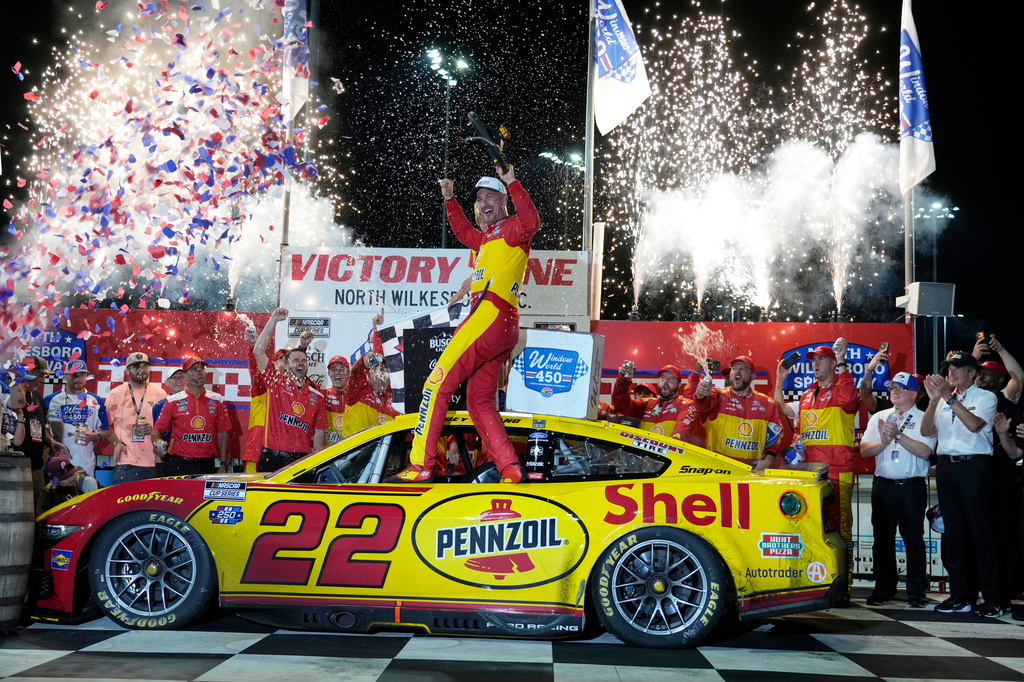Joey Logano celebrates in Victory Lane after winning a NASCAR Cup Series auto race in North Wilkesboro, N.C., Sunday, July 19, 2026. (AP Photo/Chuck Burton)