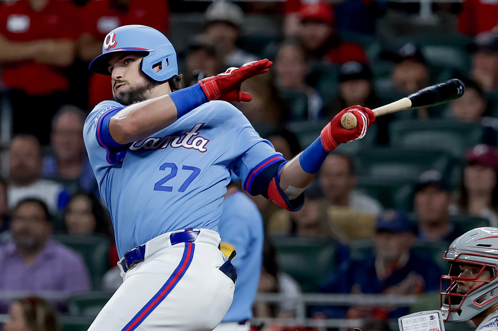 Atlanta Braves' Austin Riley (27) hits an RBI double against the Philadelphia Phillies during the fourth inning of a baseball game, Saturday, April 25, 2026, in Atlanta. (AP Photo/Erik S. Lesser)