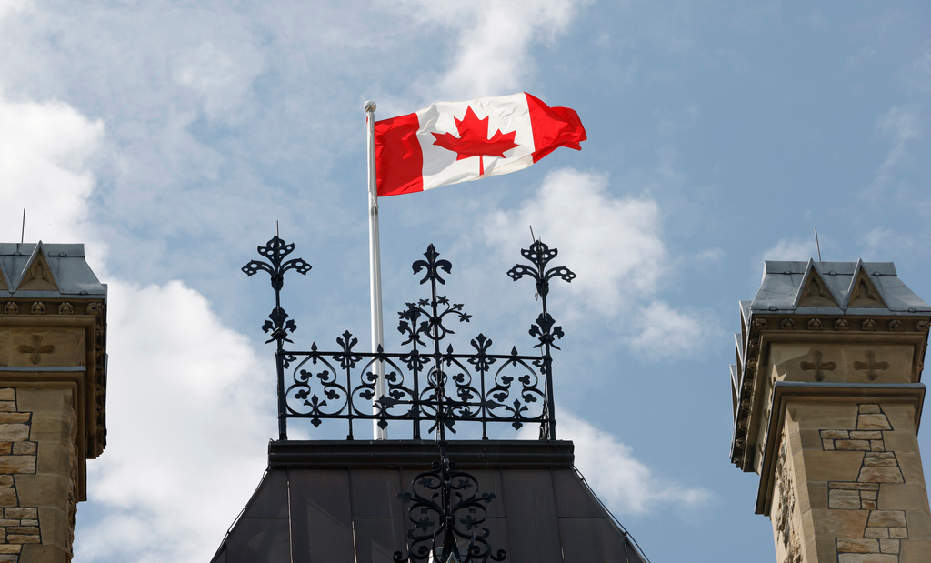 A Canadian flag flies on Parliament Hill in Ottawa on Saturday, Aug. 22, 2026. (Patrick Doyle/The Canadian Press via AP)