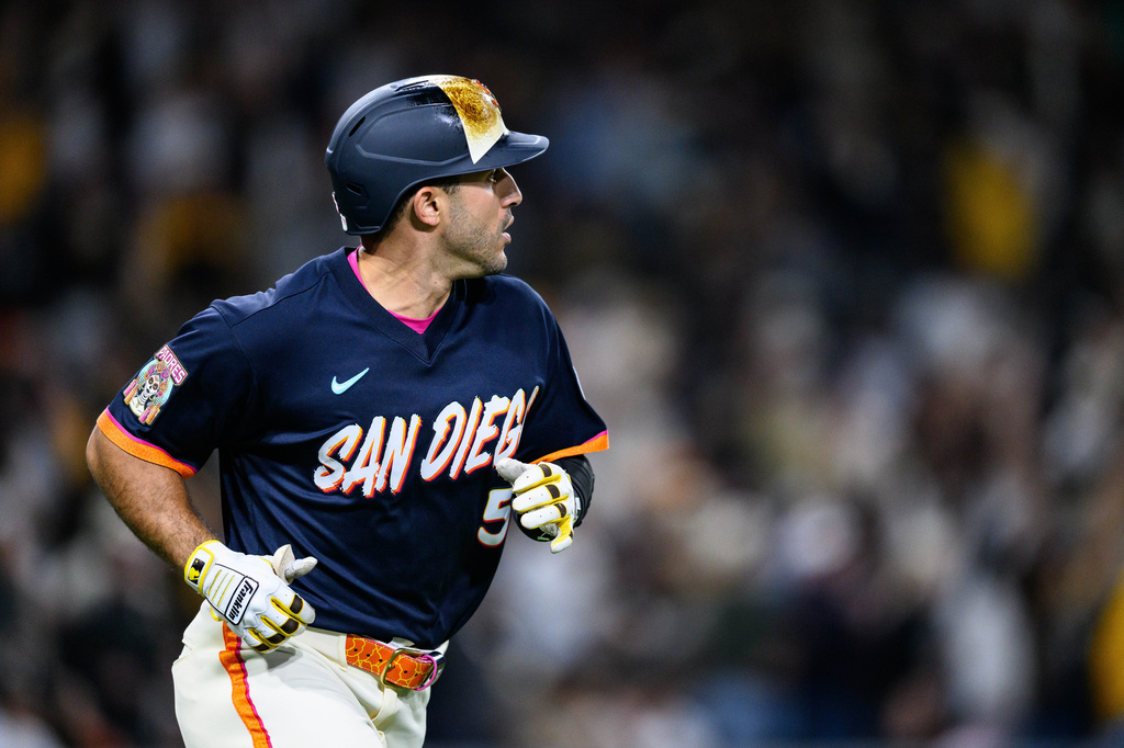 San Diego Padres' Ramón Laureano watches his home run during the seventh inning of a baseball game against the Athletics, Friday, May 22, 2026, in San Diego. (AP Photo/William Liang)