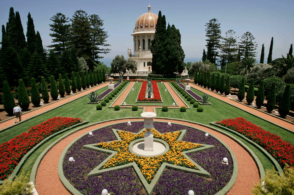 FILE - A Baha'i worshiper walks in the gardens of The Baha'i temple in the northern Israeli city of Haifa, July 14, 2008. (AP Photo/Sebastian Scheiner, File)
