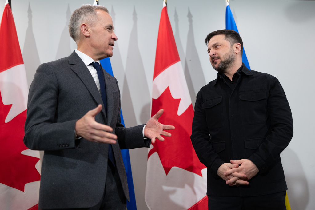 Prime Minister Mark Carney, left, and Ukrainian President Volodymyr Zelenskyy hold a news conference in Halifax, N.S. on Saturday, Dec. 27, 2025.(Riley Smith /The Canadian Press via AP)