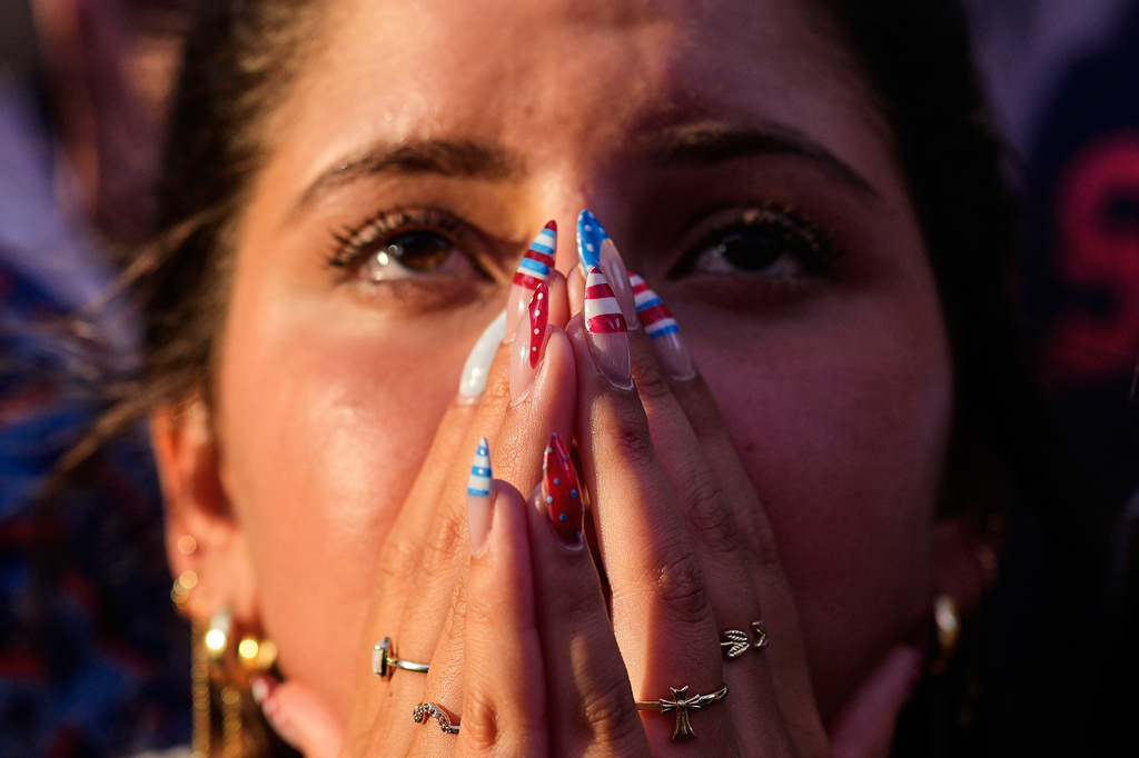 A fan reacts after a Belgium goal during a watch party for a World Cup soccer match between the United States and Belgium at the KC Live! entertainment district Monday, July 6, 2026, in Kansas City, Mo. (AP Photo/Charlie Riedel)