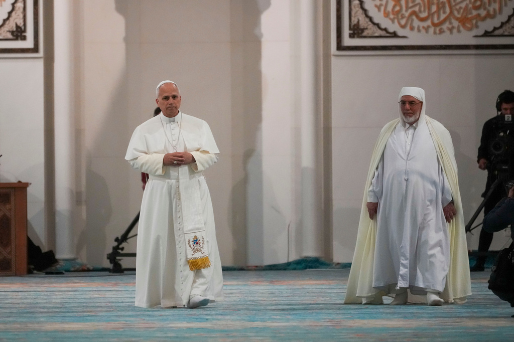 Pope Leo XIV is welcomed by Rector Mohamed Mamoun Al Qasimi upon his arrival at the Great Mosque in Algiers, Monday, April 13, 2026, on the first day of an 11-day apostolic journey to Africa. (AP Photo/Andrew Medichini)