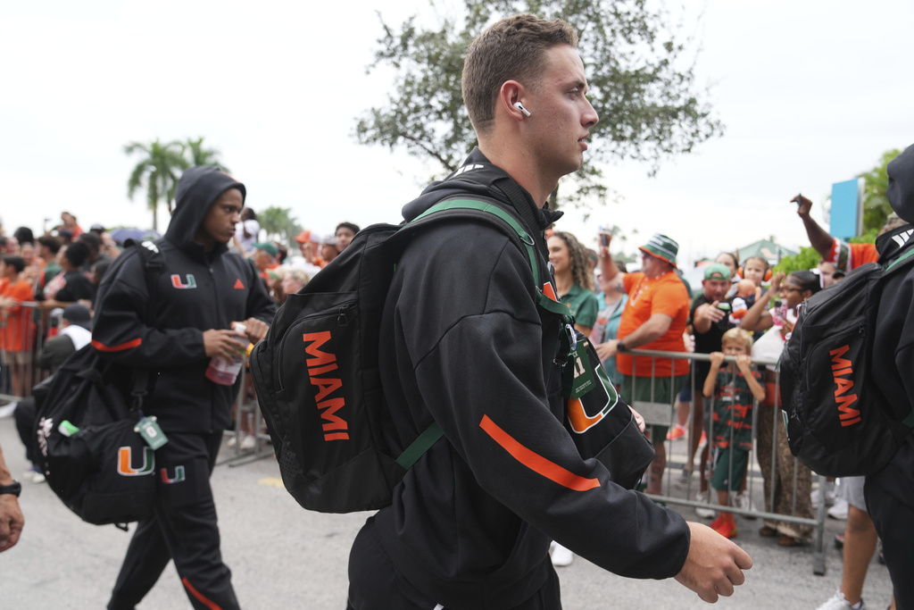 Miami quarterback Carson Beck arrives for an NCAA college football game against Bethune-Cookman, Saturday, Sept. 6, 2025, in Miami Gardens, Fla. (AP Photo/Lynne Sladky)