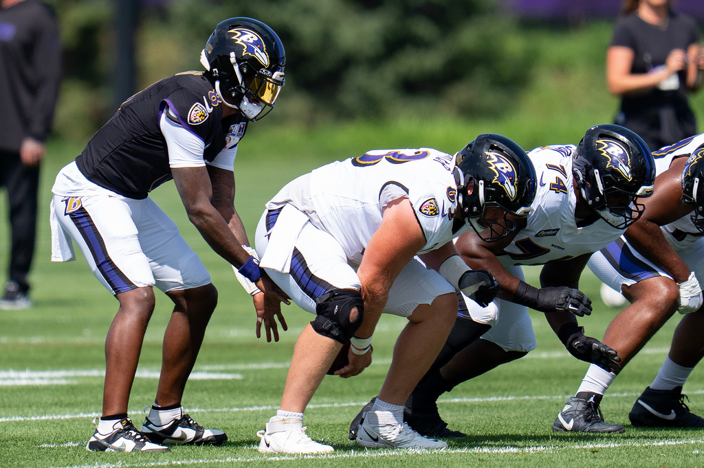FILE - Baltimore Ravens quarterback Lamar Jackson (8) takes a snap during a joint NFL football practice with the Minnesota Vikings, Aug 19, 2026, in Eagan, Minn. (Alex Kormann/Minnesota Star Tribune via AP, File)