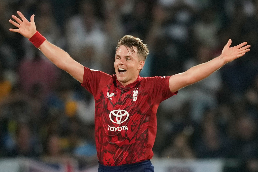 England's Sam Curran celebrates hat trick wicket during the first T20 cricket match between England and Sri Lanka in Pallekele, Sri Lanka, Friday, Jan, 30. 2026. (AP Photo/Eranga Jayawardena)