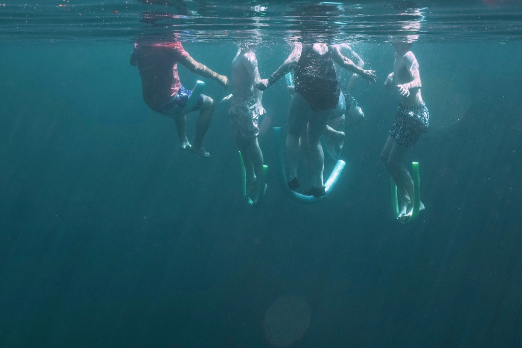 A family swims in Royal Spring, July 15, 2025, in Suwanne County, Fla. (AP Photo/Marta Lavandier, File)
