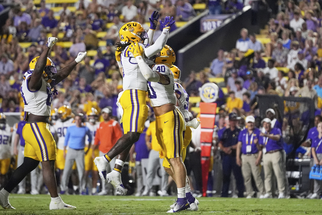 LSU linebacker Whit Weeks (40) celebrates a sack with linebacker Harold Perkins Jr. (7) in the second half of an NCAA college football game Saturday, Sept. 6, 2025, in Baton Rouge, La. (AP Photo/Gerald Herbert)