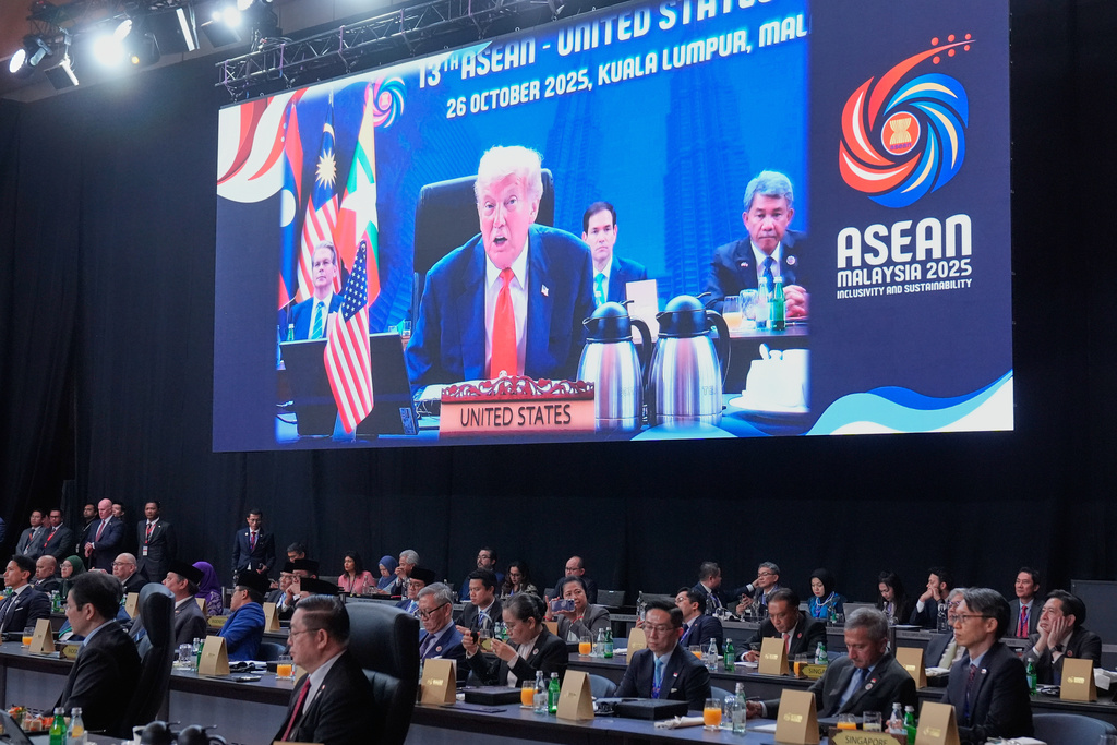 President Donald Trump is seen on a video screen a she addresses a working session of the ASEAN Summit in Kuala Lumpur, Malaysia, Sunday, Oct. 26, 2025. (AP Photo/Mark Schiefelbein)