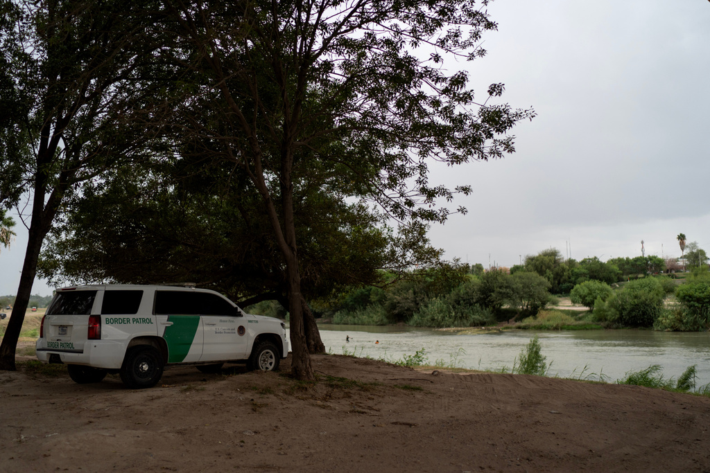 A U.S. Border Patrol vehicle sits along the Rio Grande river across the border from Mexico, Tuesday, Oct. 14, 2025, in Laredo, Texas. (AP Photo/David Goldman)