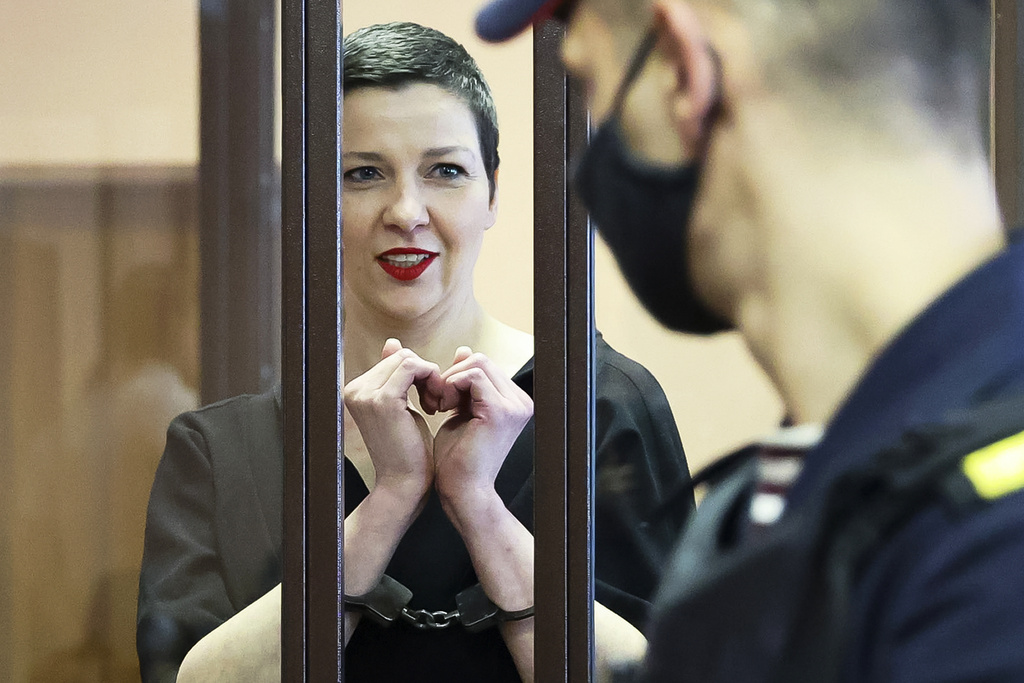 FILE - Belarus opposition activist Maria Kolesnikova stands behind bars in a defendants' cage in a court in Minsk, Belarus, on Aug. 4, 2021. (Ramil Nasibulin/BelTA Pool Photo via AP, File)