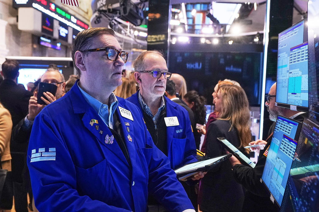 Specialist Patrick King, left, and trader Mark Puetzer work on the floor of the New York Stock Exchange, Wednesday, Jan. 28, 2026. (AP Photo/Richard Drew)
