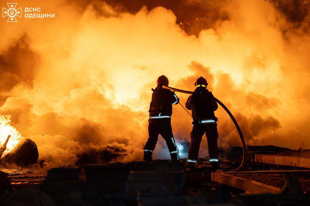 In this photo provided by the Ukrainian Emergency Services on Saturday, April 11, 2026, rescue workers put out a fire of building damaged by a Russian drone strike on Odesa, Ukraine. (Ukrainian Emergency Service via AP)