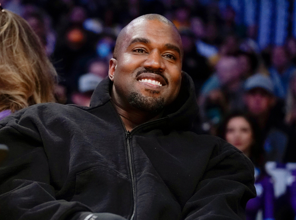 FILE - Kanye West, known as Ye, watches the first half of an NBA basketball game between the Washington Wizards and the Los Angeles Lakers, on March 11, 2022, in Los Angeles. (AP Photo/Ashley Landis, File)
