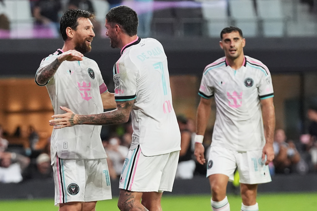 Inter Miami forward Lionel Messi, left, congratulated midfielder Rodrigo de Paul (7) after de Paul scored a goal during the first half of an MLS soccer match against New York City FC, Wednesday, Oct. 14, 2026, in Miami. (AP Photo/Lynne Sladky)