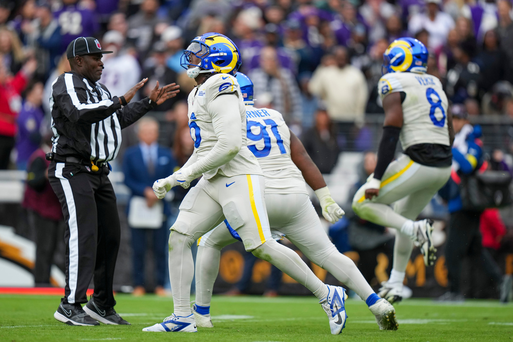 Los Angeles Rams linebacker Nick Hampton (6), defensive end Kobie Turner (91) and linebacker Jared Verse (8) react after stopping the Baltimore Ravens on a fourth down play near the goal line during the first half of an NFL football game Sunday, Oct. 12, 2025, in Baltimore. (AP Photo/Stephanie Scarbrough)