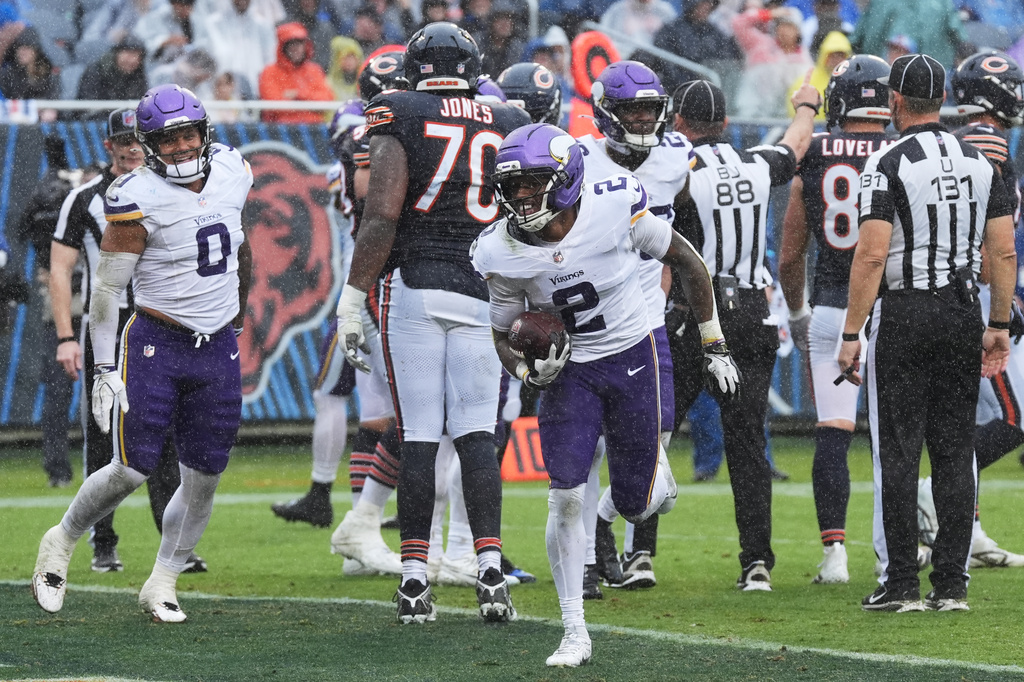 Minnesota Vikings cornerback Isaiah Rodgers (2) celebrates after recovering a fumble during the second half of an NFL football game against the Chicago Bears in Chicago, Sunday, Sept. 20, 2026. (AP Photo/David Banks)