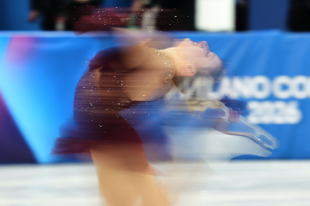 Amber Glenn of the United States competes during the women's short program figure skating at the 2026 Winter Olympics, in Milan, Italy, Tuesday, Feb. 17, 2026. (AP Photo/Francisco Seco)