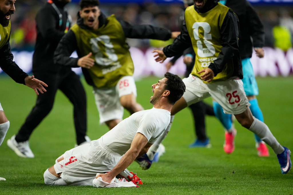 Iran's Shoja Khalilzadeh (4) celebrates after scoring a goal before it was overturned following a VAR review during the World Cup Group G soccer match between Egypt and Iran in Seattle, Friday, June 26, 2026. (AP Photo/Lindsey Wasson)