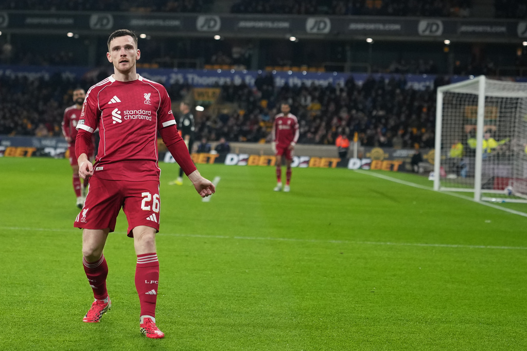 Liverpool's Andrew Robertson celebrates after scoring during the English FA Cup soccer match between Wolves and Liverpool in Wolverhampton, England, Friday, March 6, 2026.(AP Photo/Dave Shopland)