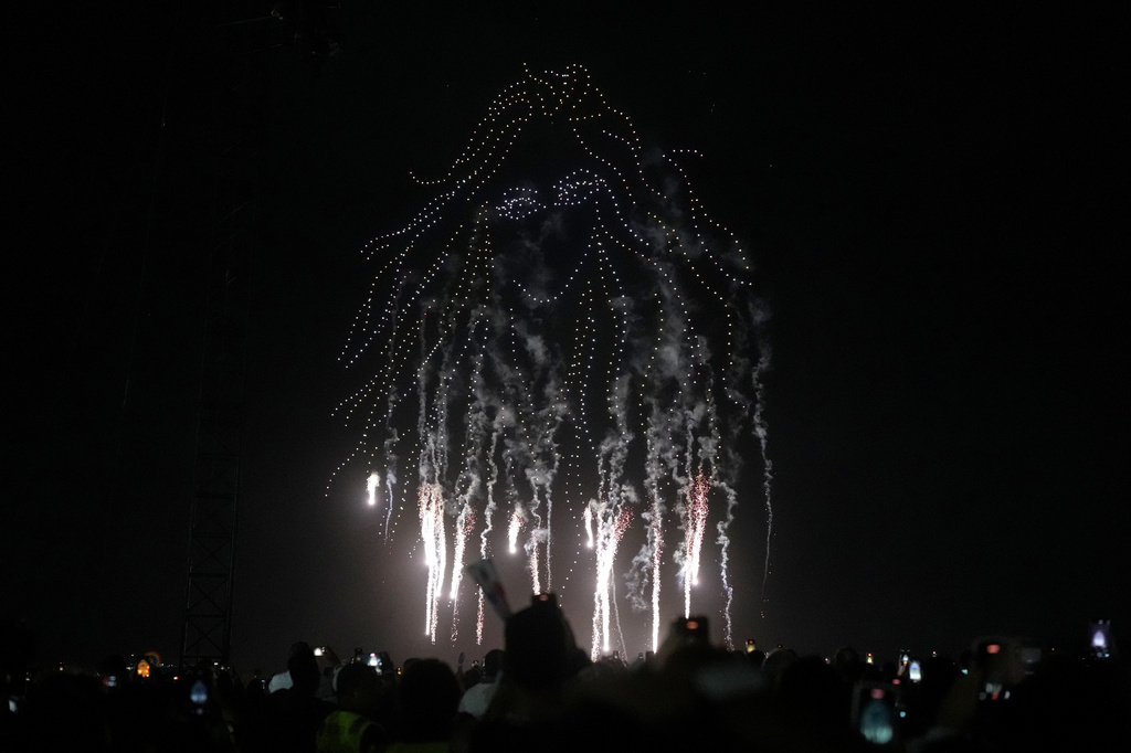 Synchronized drones display illuminated images of Colombian pop star Shakira before her free concert on Copacabana Beach in Rio de Janeiro, Saturday, May 2, 2026. (AP Photo/Silvia Izquierdo)
