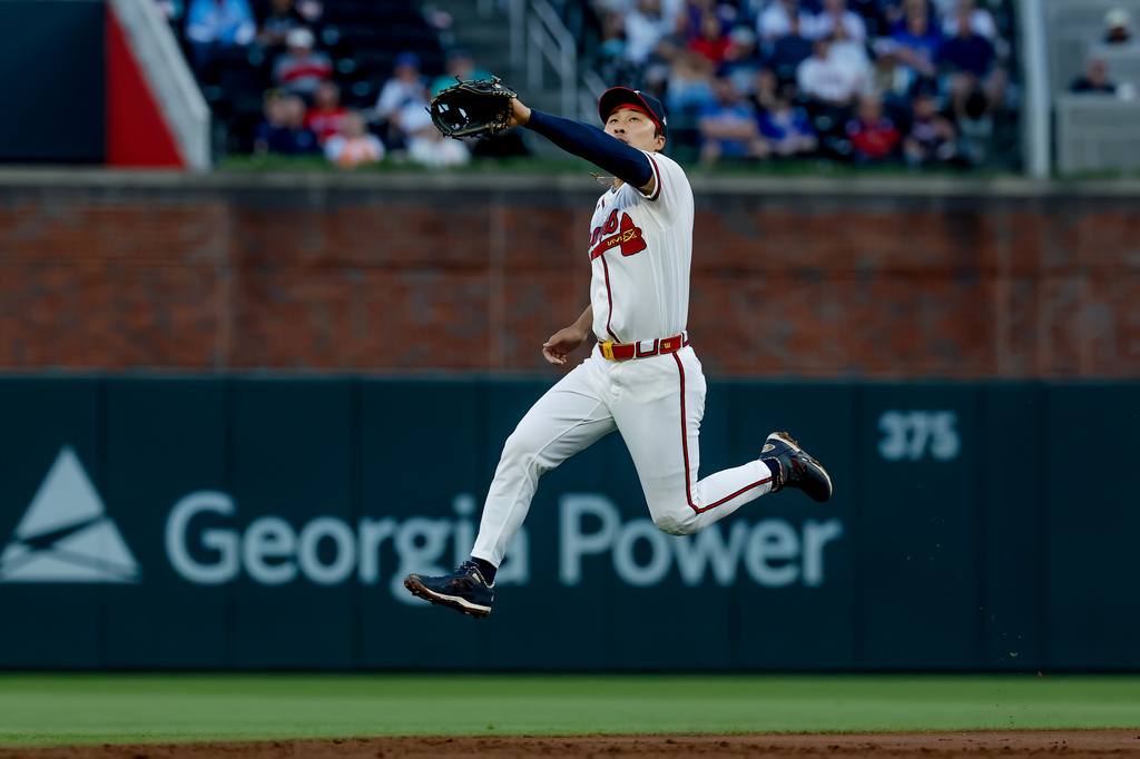 Atlanta Braves shortstop Ha-Seong Kim tries to field a single hit by Chicago Cubs' Pete Crow-Armstrong during the second inning of a baseball game, Thursday, May 14, 2026, in Atlanta. (AP Photo/Erik S. Lesser)