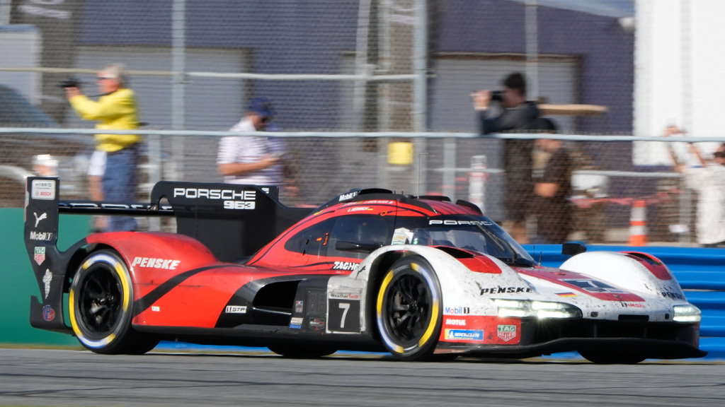 Felipe Nasr, of Brazil, enters a turn in a Porsche 963 during the Rolex 24 hour auto race at Daytona International Speedway, Sunday, Jan. 25, 2026, in Daytona Beach, Fla. (AP Photo/John Raoux)