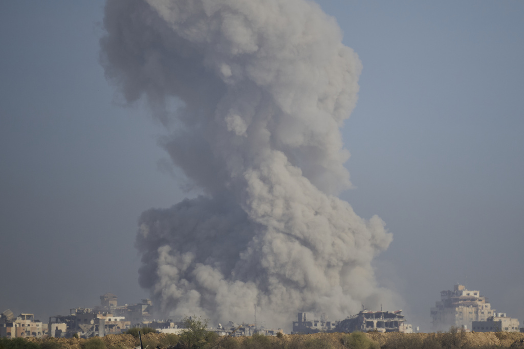 Smoke rises following an explosion in the Gaza Strip, as seen from southern Israel, Sunday, Sept. 21, 2025. (AP Photo/Ohad Zwigenberg)