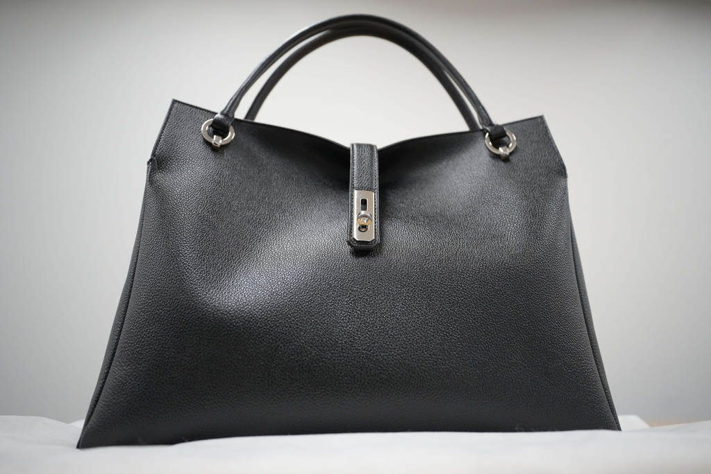 A bag named "Grace Delight Tote," made by Hamano Leather Crafts Co., Ltd., a long-established Japanese leather-goods maker, is shown in Tokyo on Tuesday, Dec. 2, 2025, as it is the same model used by Prime Minister Sanae Takaichi. (AP Photo/Eugene Hoshiko)