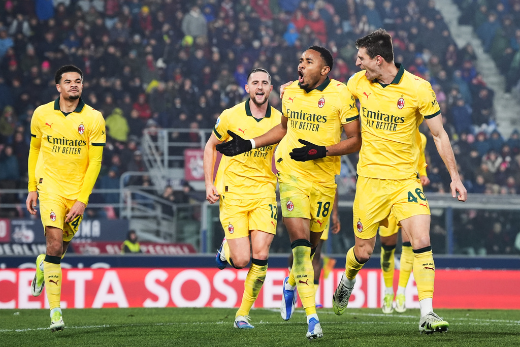 AC Milan's Christopher Nkunku, second from right, celebrates after scoring their second goal during the Serie A soccer match between Bologna and Milan in Bologna, Italy, Tuesday Feb. 3, 2026. (Massimo Paolone/LaPresse via AP)