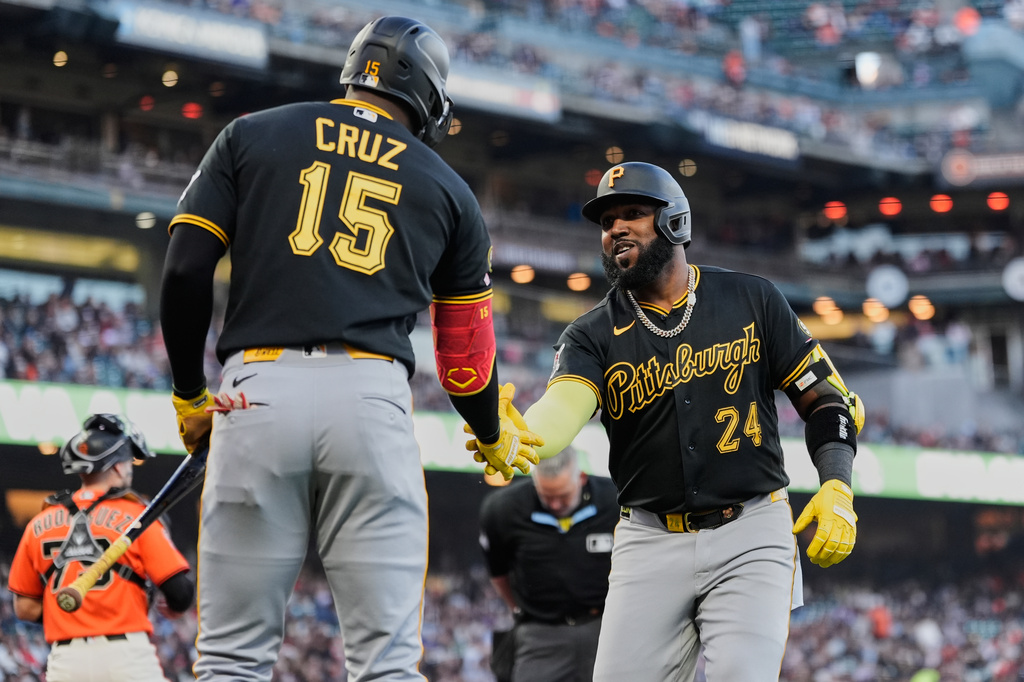 Pittsburgh Pirates' Marcell Ozuna (24) celebrates with Oneil Cruz (15) after hitting a solo home run during the second inning of a baseball game against the San Francisco Giants, Friday, May 8, 2026, in San Francisco. (AP Photo/Godofredo A. Vásquez)