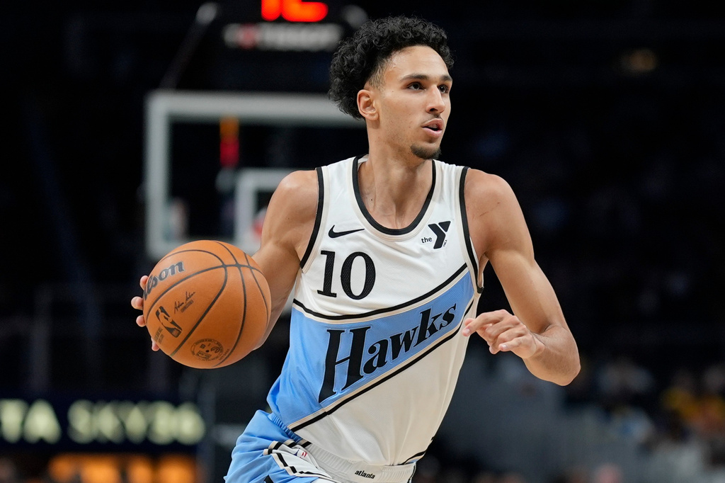FILE - Atlanta Hawks forward Zaccharie Risacher (10) moves against the Golden State Warriors during the first half of an NBA basketball game, March 22, 2025, in Atlanta. (AP Photo/Mike Stewart, File)