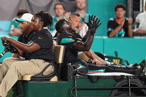 Miami Dolphins wide receiver Tyreek Hill, right font, puts his arms up as he is carted off the field after suffering an unknown lower leg injury in the second half of an NFL football game against the New York Jets, Monday, Sept. 29, 2025, in Miami Gardens, Fla. (AP Photo/Rebecca Blackwell) Miami Dolphins wide receiver Tyreek Hill, right font, puts his arms up as he is carted off the field after suffering an unknown lower leg injury in the second half of an NFL football game against the New York Jets, Monday, Sept. 29, 2025, in Miami Gardens, Fla. (AP Photo/Rebecca Blackwell)