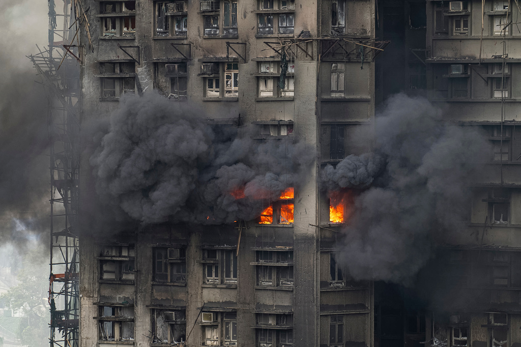 A fire can be seen at Wang Fuk Court, a residential estate in the Tai Po district of Hong Kong's New Territories, Thursday, Nov. 27, 2025. (AP Photo/Chan Long Hei)