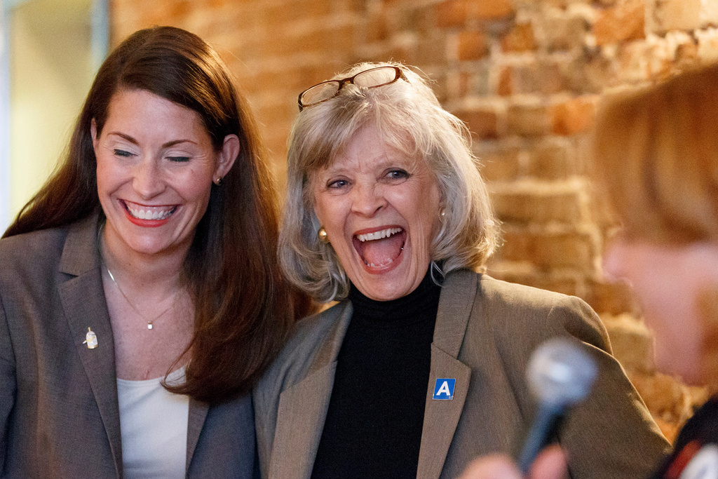 FILE - Former Kentucky Gov. Martha Layne Collins laughs during an introduction of Democrat Senate candidate Alison Lundergan Grimes as she campaigns in Paris, Ky., Wednesday, Oct. 29, 2014. (AP Photo/J. Scott Applewhite, File)