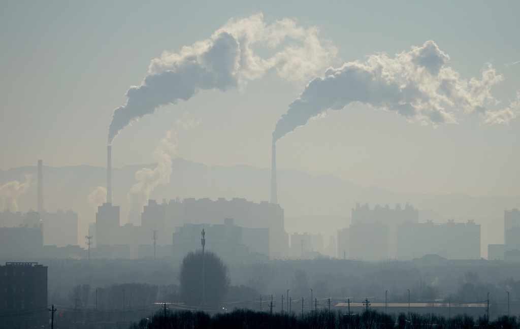 A power plant is seen from a train from Beijing to Shenyang in northwestern China on Jan. 3, 2026. (AP Photo/Ng Han Guan)