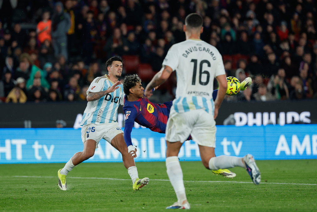 Barcelona's Lamine Yamal scores his side's third goal during a Spanish La Liga soccer match between Barcelona and Real Oviedo in Barcelona, Spain, Sunday, Jan. 25, 2026. (AP Photo/Joan Monfort)